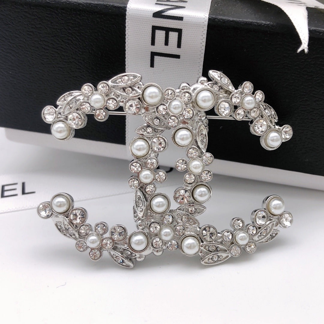 Chanel Silver Logo Brooch