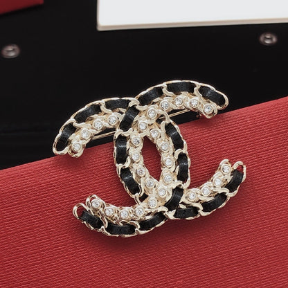 Chanel Leather & Brass Brooch