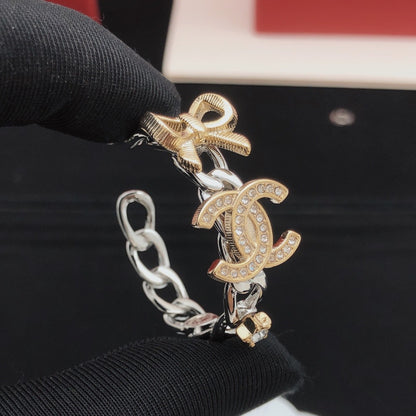 Chanel Brass Bow Earrings