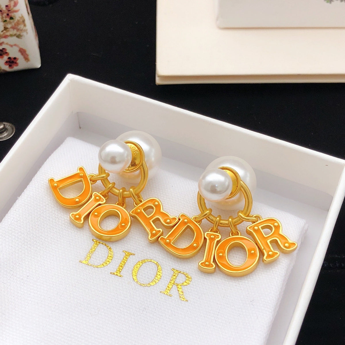 Dior Orange Brass Logo Earrings