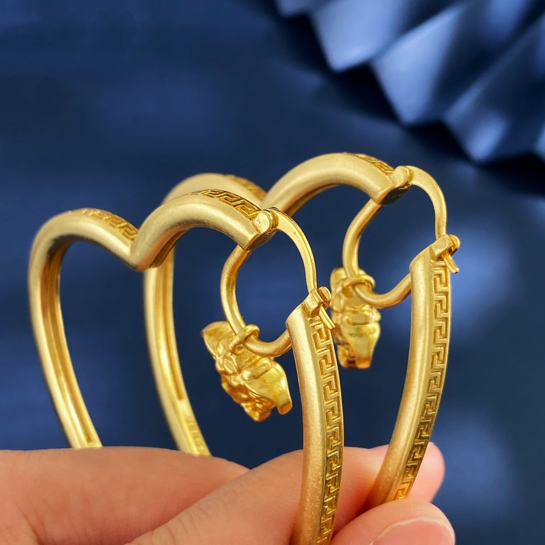 Versace Gold Brass Heart Earrings