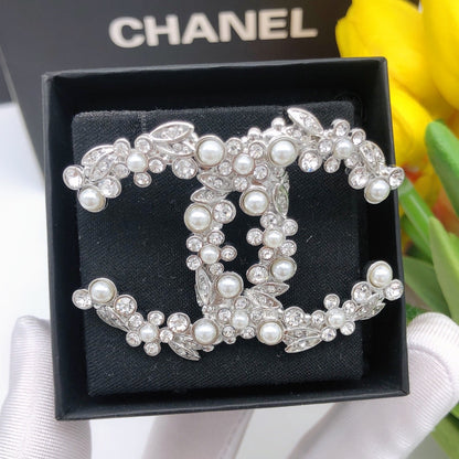 Chanel Silver Logo Brooch
