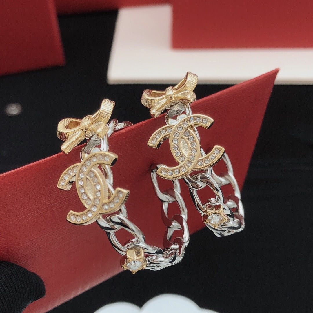 Chanel Brass Bow Earrings