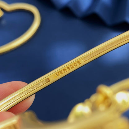 Versace Gold Brass Heart Earrings