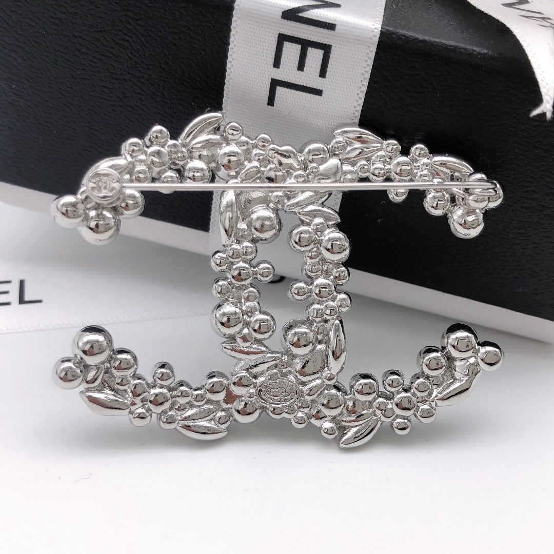Chanel Silver Logo Brooch