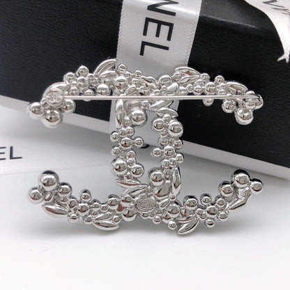 Chanel Silver Logo Brooch