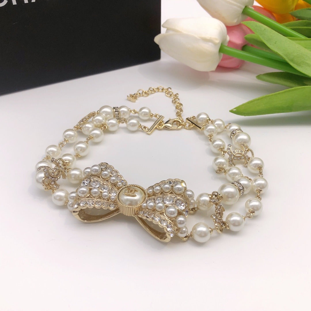 Chanel Brass & Sterling Silver Bow Necklace