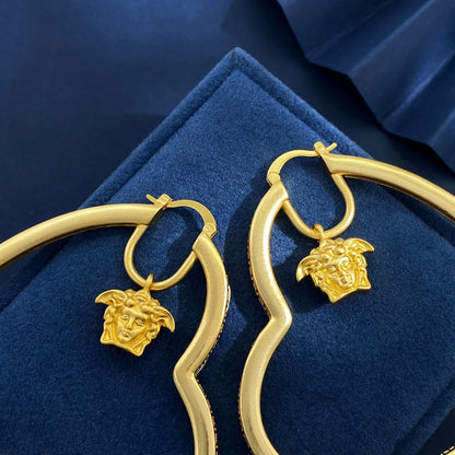 Versace Gold Brass Heart Earrings