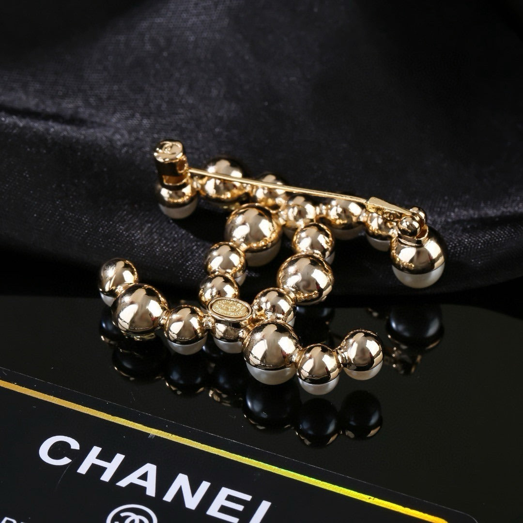 Chanel Brass Pearl Brooch