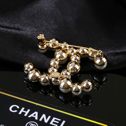 Chanel Brass Pearl Brooch