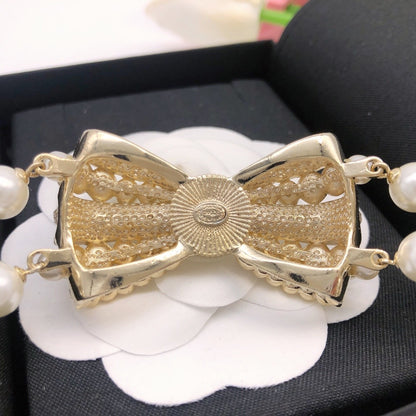Chanel Brass & Sterling Silver Bow Necklace